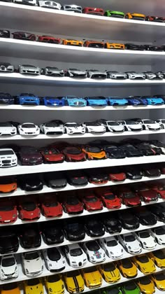 rows of toy cars on display in a store