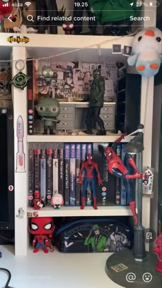 a book shelf filled with books and toys