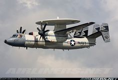 an airplane flying in the sky with propellers on it's wings and two propeller engines