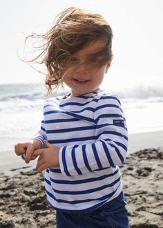 Easy to mix and match, this striped sailor shirt with 3/4 sleeves lends itself to a multitude of styles to brighten a child's day: Blue and white for little sailors, with a tulle skirt for dancing princesses, worn even with the motley colors of a clown costume....the possibilities are endless. For a Grown-Up-&-Me look, coordinates with our best selling MINQUIERS MODERNE. Made in Saint-James, Normandy, France.100% lightweight cotton jersey. White Sailor Style Long Sleeve Tops, Navy Long Sleeve Marine Top, White Marine Style Long Sleeve Top, Marine Style Long Sleeve Cotton Tops, Striped Sailor Long Sleeve Top, Sailor Striped Long Sleeve Top, Sailor Style Striped Long Sleeve Top, Playful Striped Long Sleeve Top, Striped Long Sleeve Playful Top