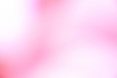 an abstract blurry background in pink and orange