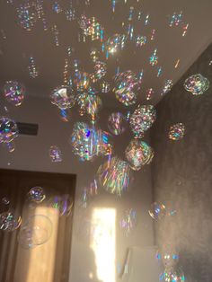 soap bubbles are floating in the air near a door