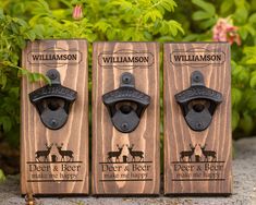 three wooden bottle openers with horse and rider logos on them are sitting in front of some flowers