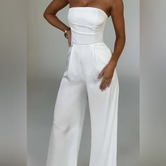 The Best Graduation Fit!! It Came In Late And Its Too Small On Me So I Never Got To Wear It. Say Hello To Tailored Perfection In The Martinez Jumpsuit. Sleek, Sexy And Sophisticated, This Wide Leg Design Is Made In Our Luxury Double Layered Satin With Stretch For Added Comfort. Featuring A Strapless Neckline With Boning To The Corset-Like Top For Added Shape, It Has Box Pleats To The Front And Is Finished With Pockets. White High-waisted Strapless Jumpsuit For Night Out, White High Waist Fitted Strapless Jumpsuit, Graduation Jumpsuit, Wedding Rehearsal Outfit, Rehearsal Outfit, Asymmetric Jumpsuit, Black Romper Shorts, Velvet Jumpsuit, Strapless Neckline