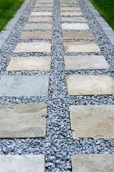 a walkway made out of stones and gravel