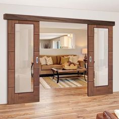 an open living room with sliding doors leading to the dining room and sitting room area