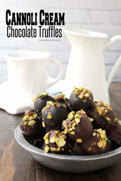 chocolate truffles with pistachios in a bowl on a wooden table