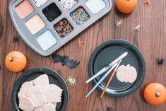 the table is decorated with halloween treats and decorations