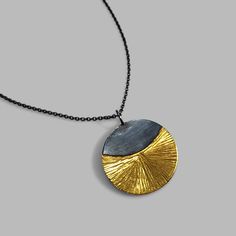 A beautiful and stylish necklace that will shine from day to night. Made of sterling silver and 24k gold keum boo and finished with a dark patina. Measure: Hangs from an 18 inch chain, the pendant is about an inch across. Arrives to you in a gift box with foam padding and tissue paper. This item is a special made to order piece. Please allow me at least one week to complete your piece before it is shipped. If you need this item right away or shipped to a different location please contact me. Keum Boo Jewelry Pendants, Modern Gold Necklace With Oxidized Finish, Modern Oxidized Gold Necklace, Keum Boo, Jewelry Design Inspiration, Stylish Necklace, Tissue Paper, Patina, Jewelry Design