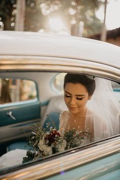 the bride is getting out of her car