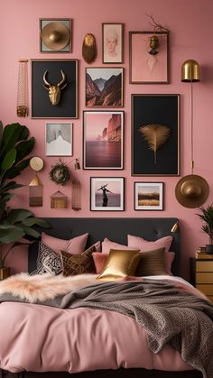 a bedroom with pink walls and pictures on the wall