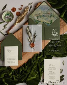 the wedding stationery was done in green and gold