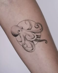 an octopus tattoo on the arm