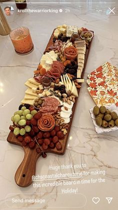 a wooden platter filled with lots of different types of food