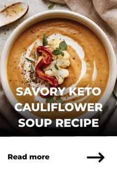 Bowl of creamy cauliflower soup garnished with cauliflower florets and herbs.