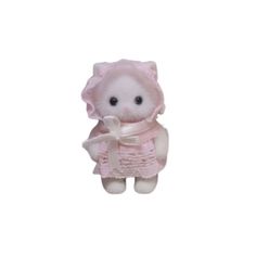 a small white teddy bear wearing a pink dress