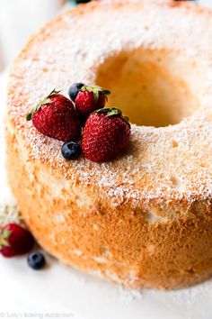 a bundt cake with three strawberries on top