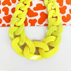 "Oversized chunky chain necklace entirely handmade link by link from polymer clay in bright yellow finished with chunky silver plated chain (can be finished with other chains too, see options). Unique yet versatile statement necklace, ideal for color blocking outfit in bright Summer shades. Length: choose between 16 to 32 inches and extender for extra 2\" (44 to 81cm + 5cm extender). Lobster clasp closure on the back. Chain links are approx 2 -1 1/2 long inch and smaller in the ends of the neckl Trendy Yellow Chain Necklace, Trendy Yellow Necklace With Adjustable Chain, Bold Chunky Chain Necklace, Trendy Yellow Chain Jewelry, Back Chain, Chunky Chain Necklace, Color Blocking Outfits, Summer Shades, Chunky Chain Necklaces