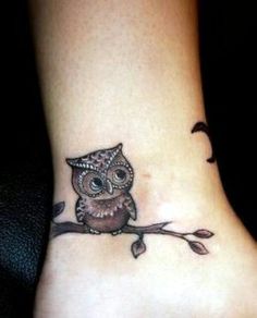 an owl tattoo on the ankle