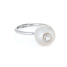 Finely detailed estate cultured pearl & diamond ring, crafted in 14 karat white gold.   The cultured pearl measures 10mm with a diamond inset into the pearl (estimated at 0.05 carats - H-I colour/VS2 clarity). The stones are in excellent condition and free of cracks or crisps.   The stylish high rising ring features a gemstone-in-gemstone design. The diamond is artfully bezel set into the pearl for a striking and unusual look . A great ring to wear alone or stacked with your fine jewellery from White Pearl Ring With Diamond, White Diamond Pearl Drop Ring, White Pearl Diamond Ring With Pearl Drop, Elegant Round Mother Of Pearl Ring, Wedding Pearl Ring With Mother Of Pearl, Pearl White Diamond Ring With Pearl Drop, Wedding Pearl Ring In Mother Of Pearl, White Gold Pearl Ring With Pearl Drop, Pearl White Diamond Pearl Ring With Drop Detail