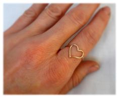 "A Swollen, slightly asymmetrical heart makes this ring unique, flirty, sassy, and fun. Maybe a promise ring, or maybe a gift for yourself, this ring is sure to draw attention at any occasion. I make this ring from from 18ga wire in 14k gold filled or sterling silver. The heart is hand formed and soldered to make a long lasting, durable ring. DIMENSIONS: The heart is approximately 12mm tall and 13mm wide. ------------------------------ MATERIALS: 14k gold filled or sterling silver -------------- Ring Unique, Christmas Sale, Promise Ring, Unique Rings, Promise Rings, To Draw, Statement Rings, Heart Ring, Gold Filled