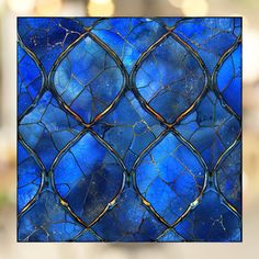 a stained glass window with blue and gold designs