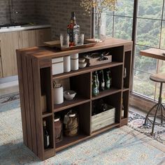 a kitchen with an open shelving unit next to a window