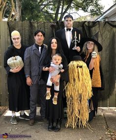 a group of people dressed up in halloween costumes