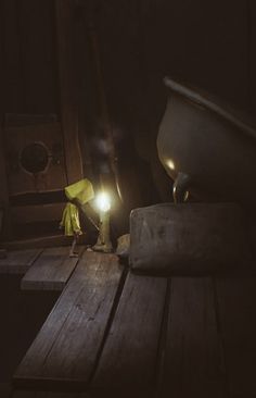 a wooden table topped with a light next to a toilet