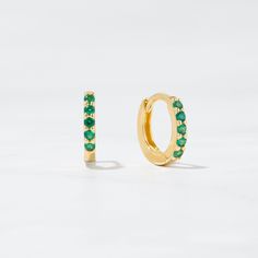 Beautiful, minimalist huggie hoop earrings * Made of 925 Sterling Silver * 14k Gold or Rose Gold Plated (we use a very thick plating, for a piece that will be in your jewelry box for years to come) * Inner Diameter Measures 7 mm * Outer Diameter Measures 9mm * Features 5 Emerald CZ Stones * SOLD as a PAIR! * Snug Fit Also available in Sapphire, Black Spinel, and Ruby CZ Ships same day! Happy to answer any questions! Green Hoop Huggie Earring, Green Round Huggie Earrings For Pierced Ears, Green Huggie Earrings For Everyday Wear, Green Round Huggie Earrings, Everyday Green Huggie Earrings, Green Huggie Hoop Earrings For Everyday, Dainty Green Huggie Hoop Earrings, Minimalist Green Hoop Huggie Earrings, Green Minimalist Small Hoop Huggie Earrings