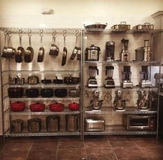 the shelves are full of pots and pans