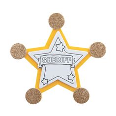 a yellow and white star shaped pin with glitter on it