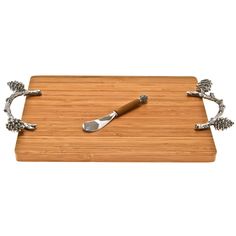 a wooden cutting board with two knives on it