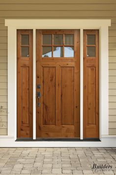 two wooden doors on the side of a house with brick flooring and white trim