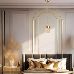 a large bed with gold pillows in a bedroom