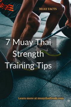 a man squats on the ground while holding a barbell in front of him