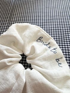 a black and white checkered table cloth with the words bride to be written on it