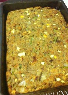 a pan filled with food sitting on top of a stove