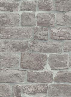 a brick wall made out of grey stones