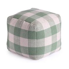 a green and white checkered poufce on a white background