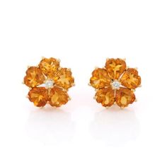 This is part of Chairish’s Fine Jewelry assortment.  Studs create a subtle beauty while showcasing the colors of the natural precious gemstones and illuminating diamonds making a statement.  Heart cut citrine studs in 18K gold. Embrace your look with these stunning pair of earrings suitable for any occasion to complete your outfit.  PRODUCT DETAILS :-  > Material - 18K Solid Yellow Gold > Gemstone - Citrine > Gemstone Weight - 6.5 ct > Gemstone pcs - 10 > Gemstone shape - Heart > Gemstone size - Yellow Gold Citrine Gemstone Earrings, Orange Citrine Gemstone Earrings, Chanel Stud Earrings, Unique Studs, Stud Earrings Unique, Boho Chic Earrings, Floral Studs, Gemstone Stud Earrings, Heart Gemstone