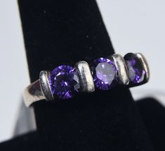 Nice modern design sterling silver ring with channel set round cut purple cubic zirconia. Size 8 1/4 7.7g Pink Sapphire Ring, Purple Band, Cubic Zirconia Rings, Channel Set, Pink Sapphire, Rings Statement, Pandora Charm Bracelet, Beautiful Rings, Blue Sapphire