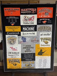 a quilt made to look like the college football team's name is displayed on a stand