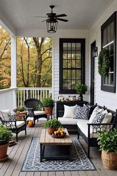 the porch is decorated with black and white furniture