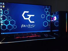 a laptop computer sitting on top of a desk in front of a monitor and keyboard