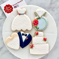 decorated wedding cookies on a plate