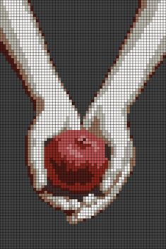 a cross stitch pattern with an image of two hands holding a red apple