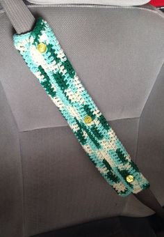 the seat belt is decorated with sequins and beads