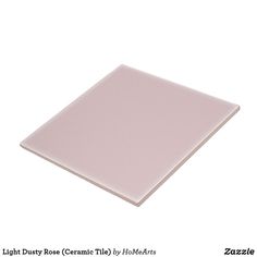 a light pink ceramic tile with white border