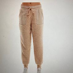 Planet Gold Elevates Casual Style With These Flattering High Rise Jogger Pant Finished With A Soft Sherpa Detail Patch Pockets At Front Pull On Style Elastic Waist Band With A Drawstring Ribbed Cuffs Size Small Color Is Cream 100% Polyester An Offer Is Welcome, And You Can Make A Bundle For More Discount. Beige Bottoms With Pockets For Winter, Beige Winter Bottoms With Pockets, Winter Beige Bottoms With Pockets, Cozy Pants With Pockets For Winter, Cozy Winter Pants With Pockets, Cream Relaxed Fit Bottoms For Winter, Winter Beige Pants With Elastic Waistband, Cream Pants With Pockets For Winter, Cozy Winter Bottoms With Pockets